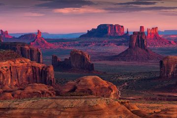 Desert setting with pillars of rock.