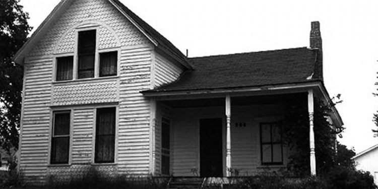 Black and white photo of an old house.