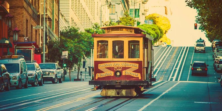Cable car on a hilly street in San Francisco.