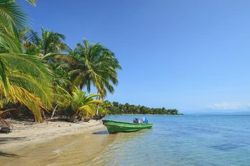 a boat on the beach in Bocas del Toro, Panama