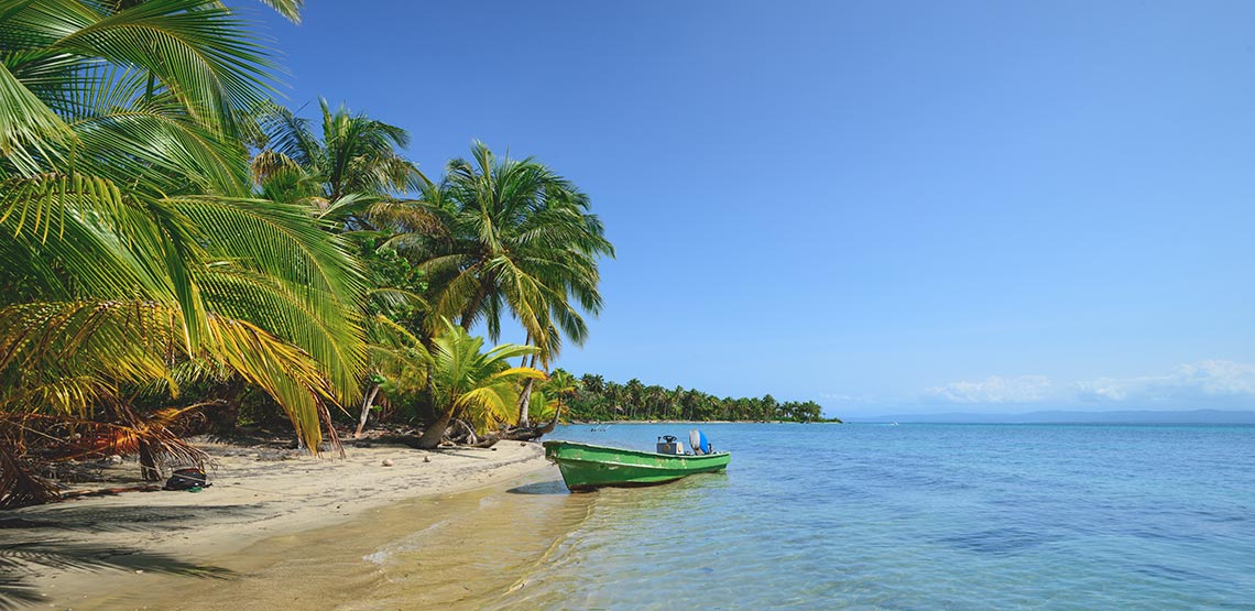 a boat on the beach in Bocas del Toro, Panama