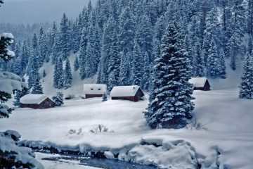 Cabins in a wintery mountain scene