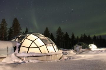 Glass igloo with view of the Northern Lights