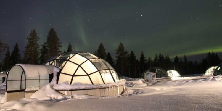Glass igloo with view of the Northern Lights