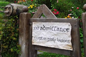 Sign on gate reading "no admittance except on party business"