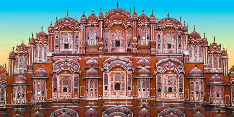 A frontal view of the The Palace of the Winds (also known as the Hawa Mahal) and its delicately carved rose-colored windows
