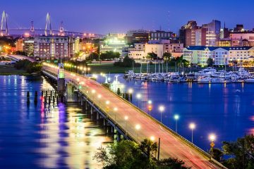A Charleston, South Carolina skyline over the Ashley River viewed at night