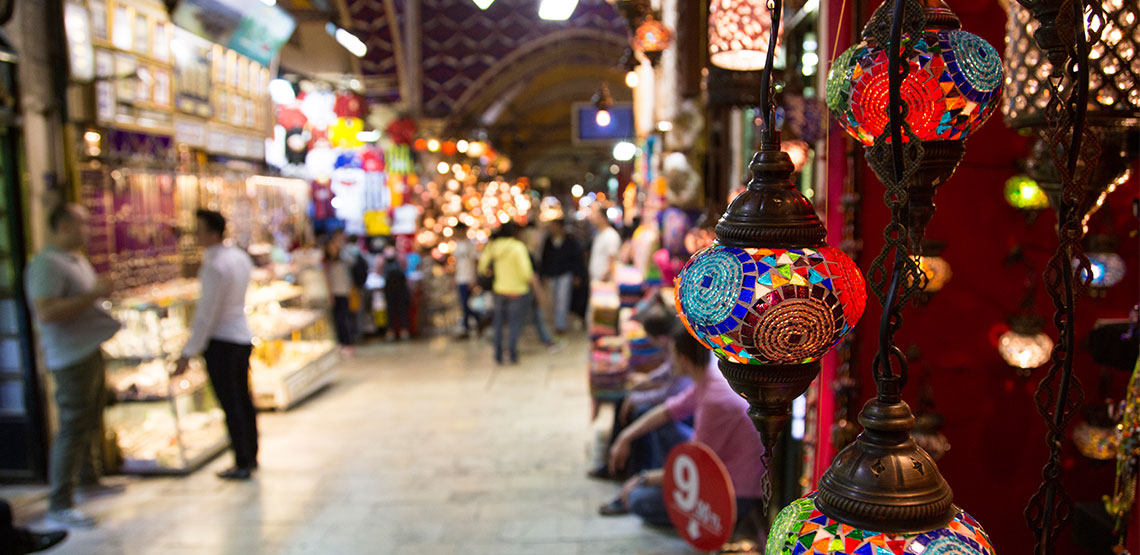 An indoor marketplace with colorful lights