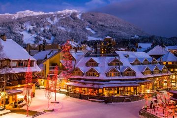 Scenic Whistler village with snowy Blackcomb mountain in background