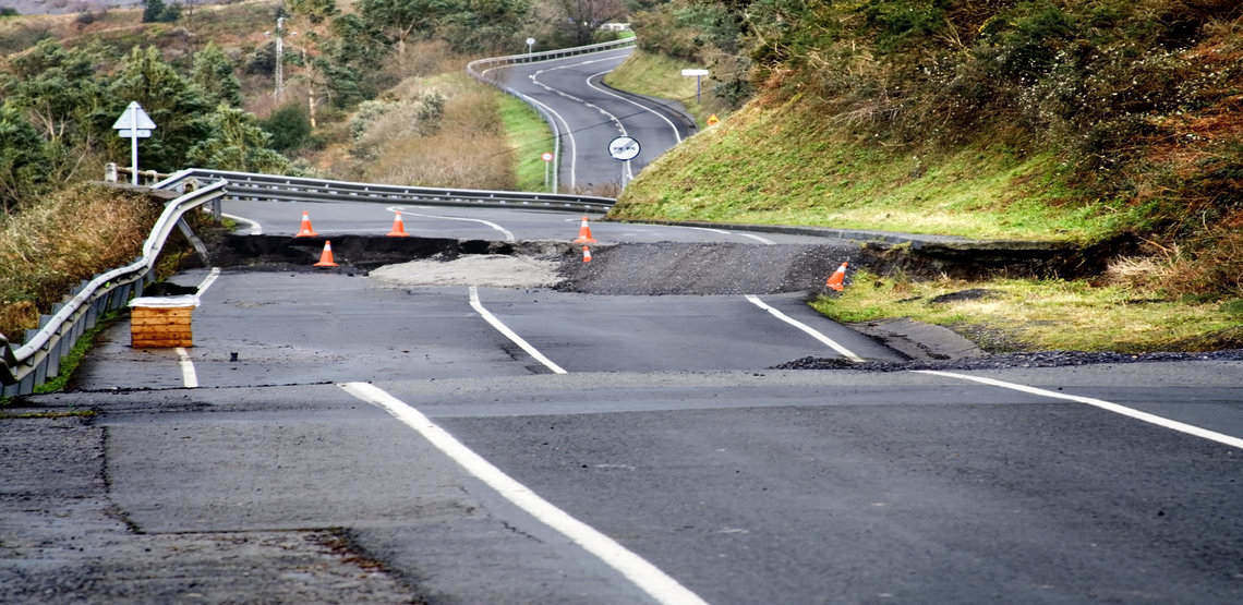 A broken road as a result of a hurricane.
