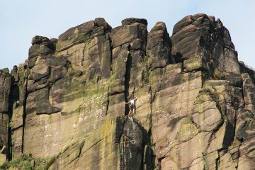Someone rock climbing at The Roaches