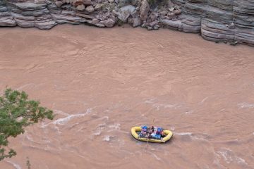 Raft on Colorado River going through Grand Canyon