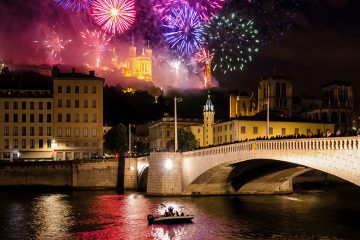 Fireworks over river and bridge