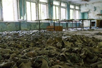 Discarded gas masks on the floor of a room in Chernobyl