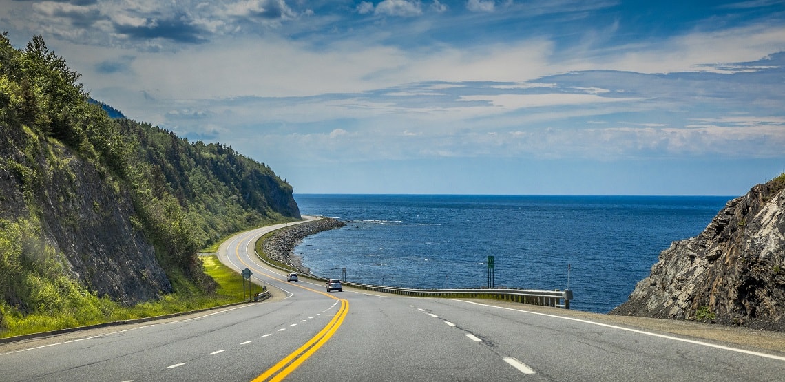 Right by the Saint Lawrence river, a look at beautiful Quebec Route 132, near Cap-au Renard (La Martre) in Haute-Gaspésie, situated in the Eastern part of the Canadian province.