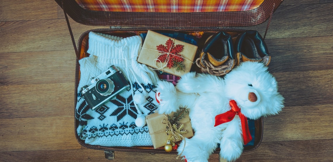 Open Suitcase with Christmas gifts