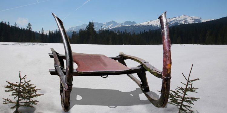 Sled with mountains in background