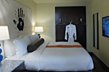 Hotel room with bed and house coat