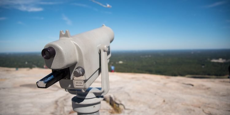 A view from the top of Stone Mountain, Georgia, with a telescope in the foreground