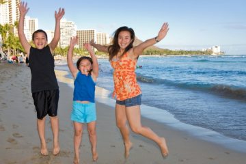 Family on the beach in Honolulu