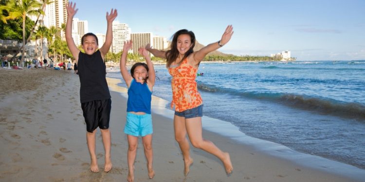 Family on the beach in Honolulu