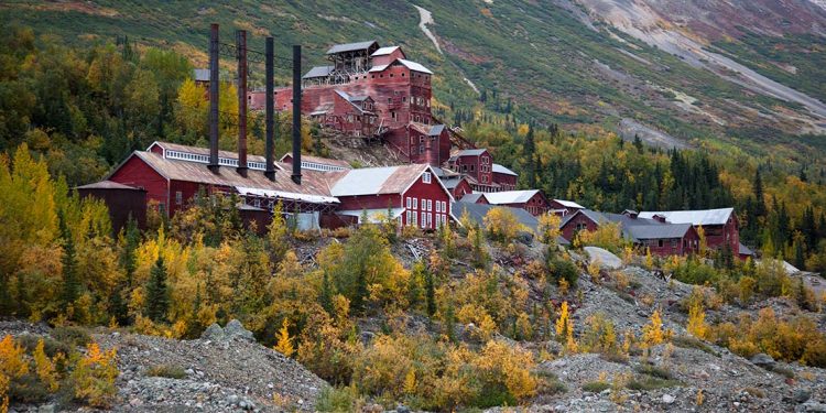 Old red mining buildings up on a hillside
