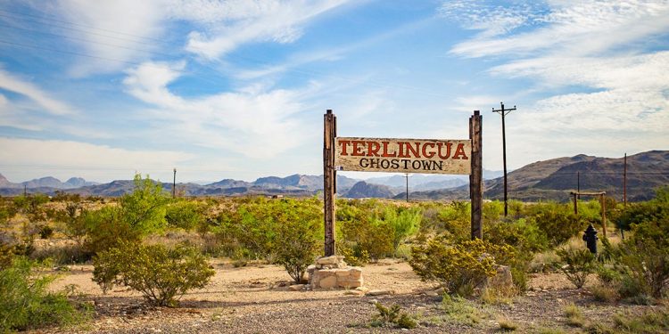 Sign for Terlingua with mountains in background