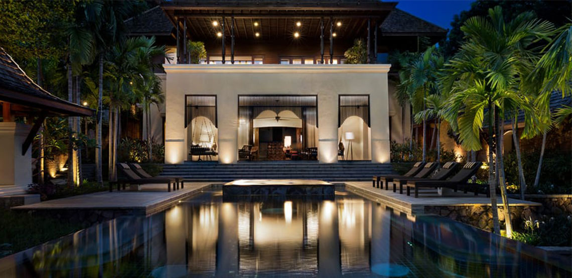 Opulent guest house with pool in foreground