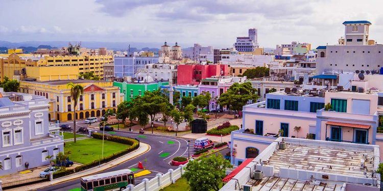 An aerial view of Old San Juan's buildings, their facades painted in a bright rainbow of colors