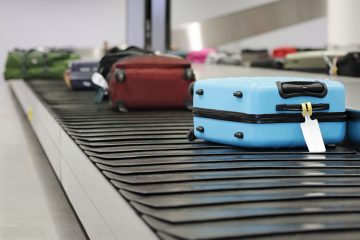 Suitcases on a conveyor belt.