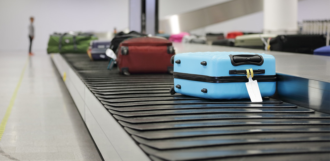 Suitcases on a conveyor belt.