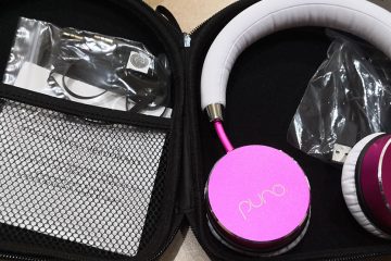 Pink headphones in an open case