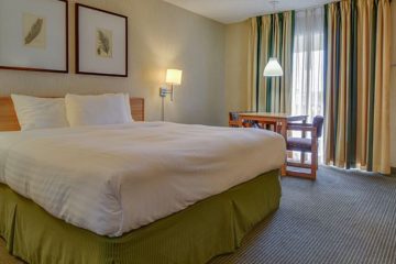 White bed in simple hotel room