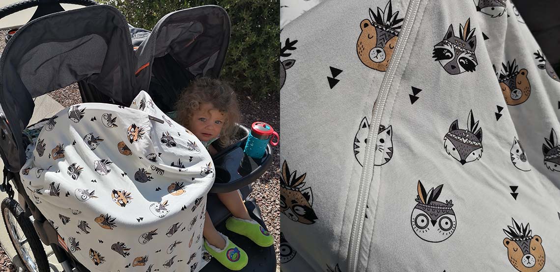 Animal print cover over a car seat in a double stroller