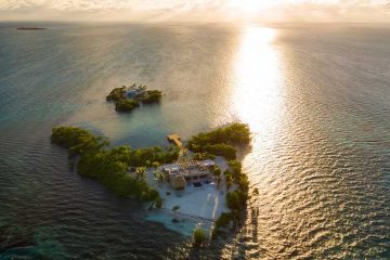 An overhead view of Gladden Island with the sunset in the background.